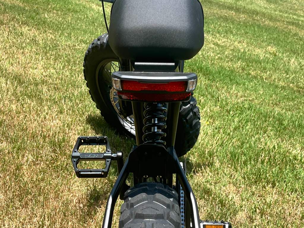 A Ride1Up Revv1 DRT e-bike parked on grass