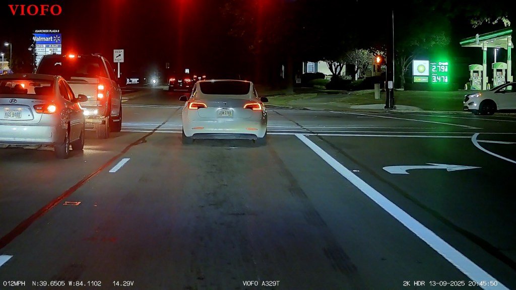 Cars on a street at night