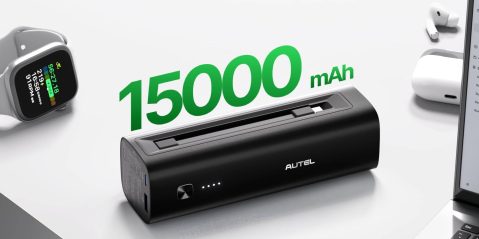 A black rectangular device with a green text