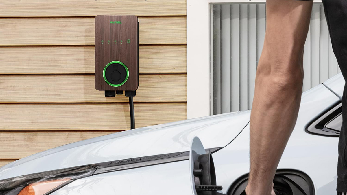 A man holding a charging station