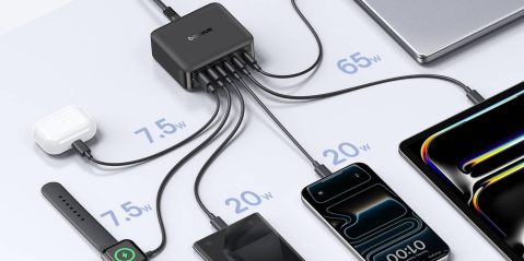 A group of cell phones connected to a charger