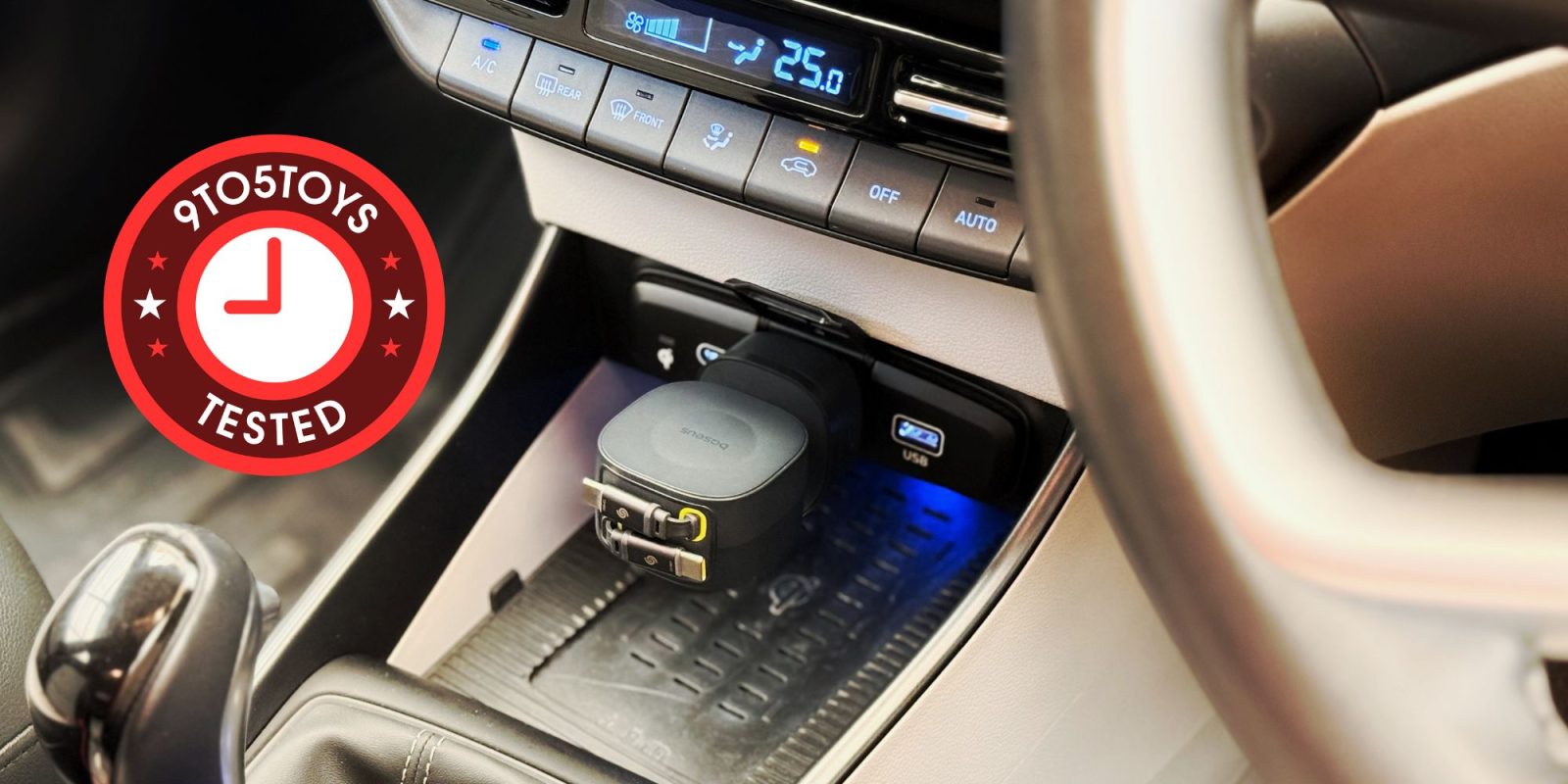 Image showing Baseus' 240W car charger plugged into a car's auxilary port.