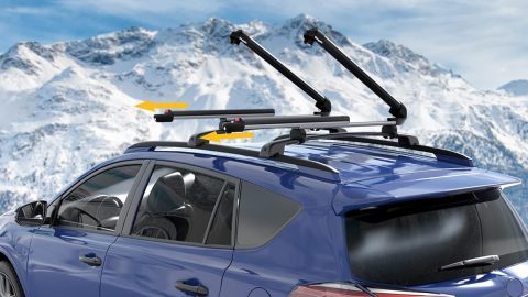 A blue car with a roof rack on top
