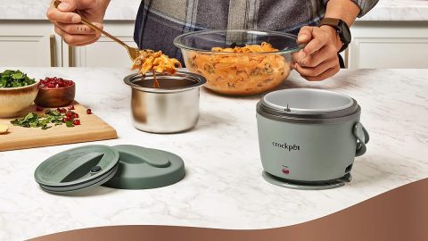 A person cooking food in a crock pot