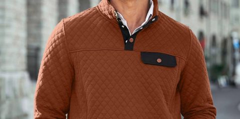 A man wearing a brown jacket