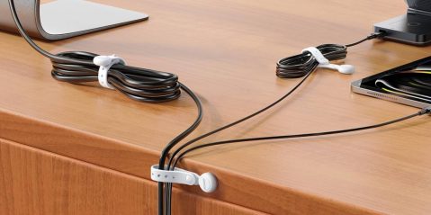 A black wires tied together on a table