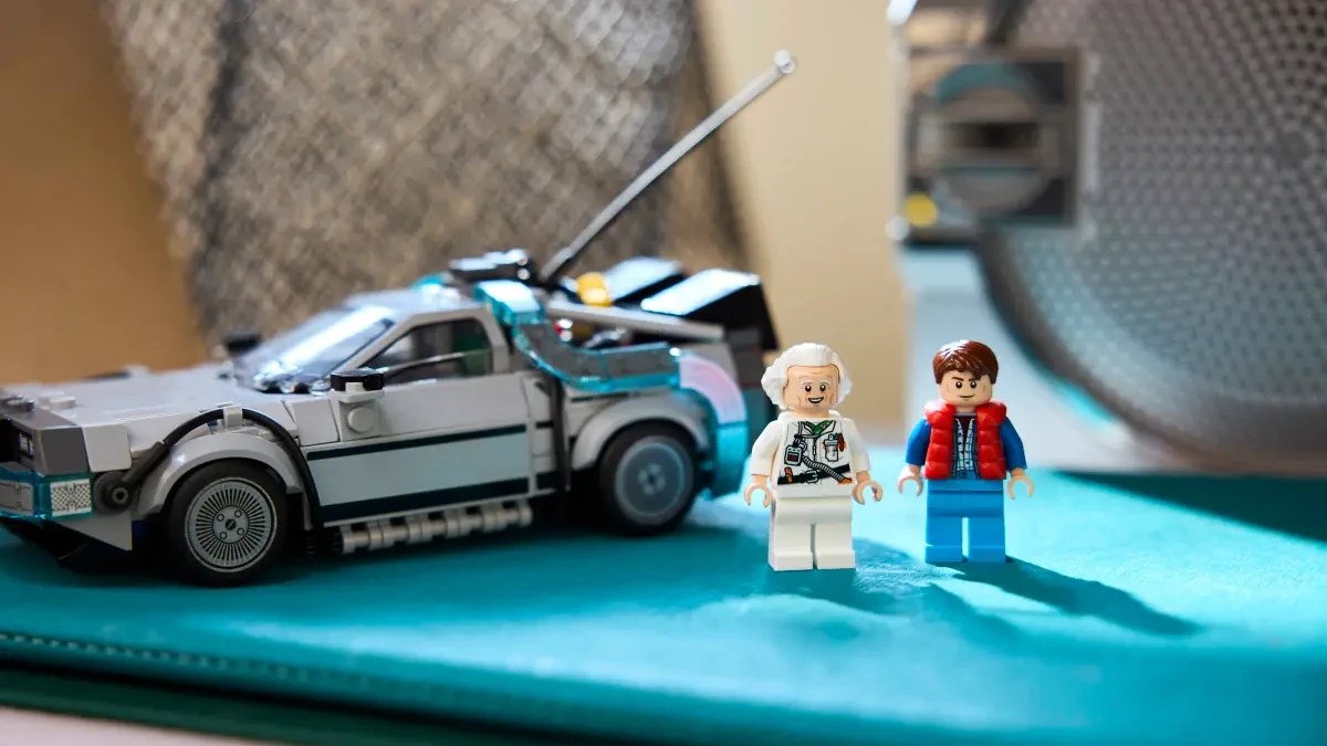 A toy car and two lego figures