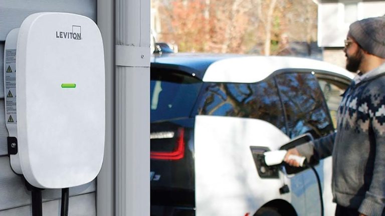 A person opening a gas tank