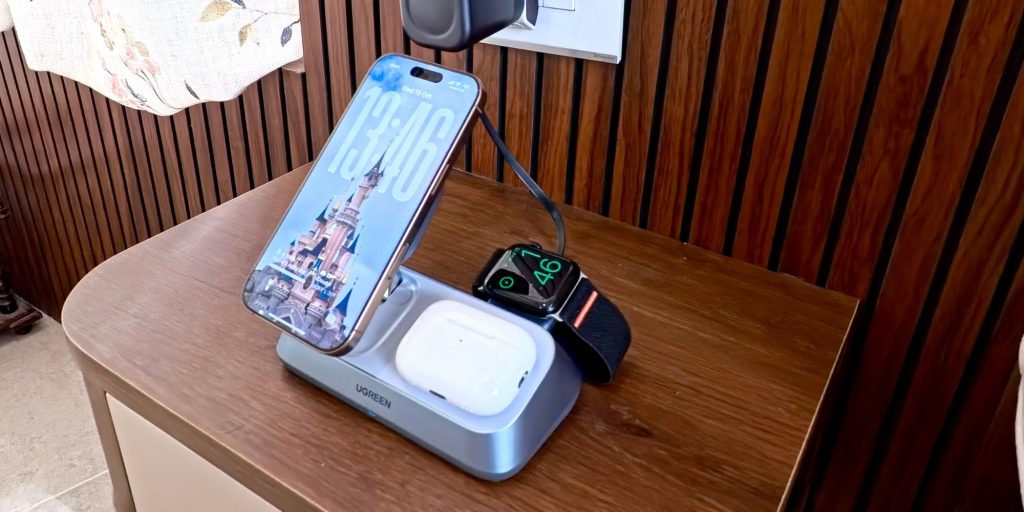 A cell phone and watch on a charging station