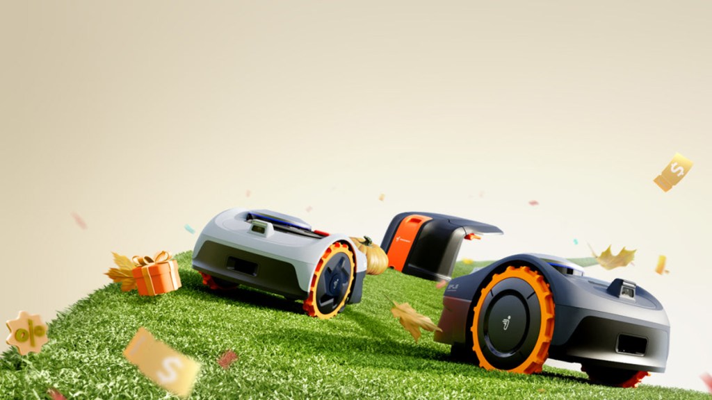 A group of robotic lawnmowers on a grassy hill