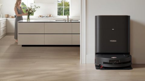A robot vacuum cleaner in a kitchen