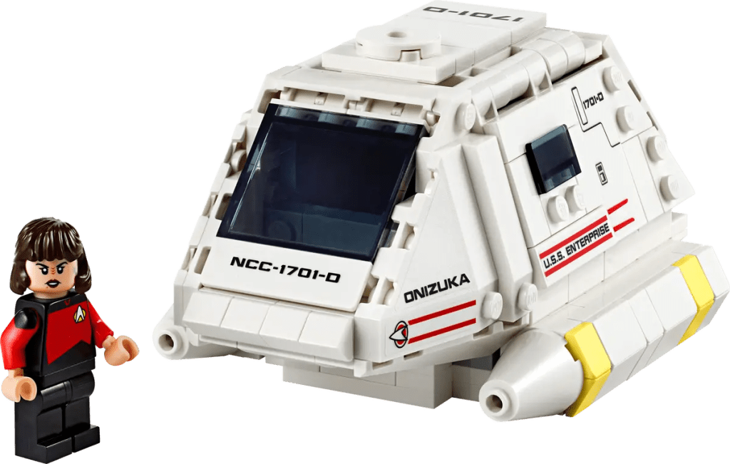 A toy vehicle with a person standing next to it