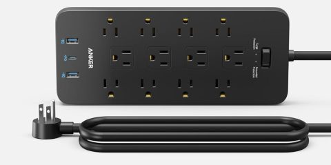 A black power strip with multiple outlets