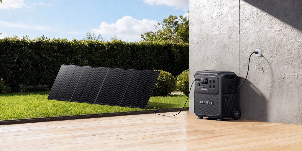 A solar panel next to a power box