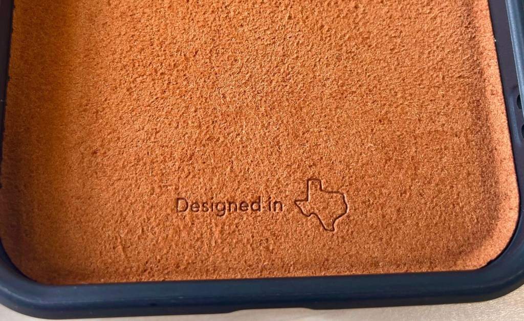 A brown leather surface with a texas symbol on it