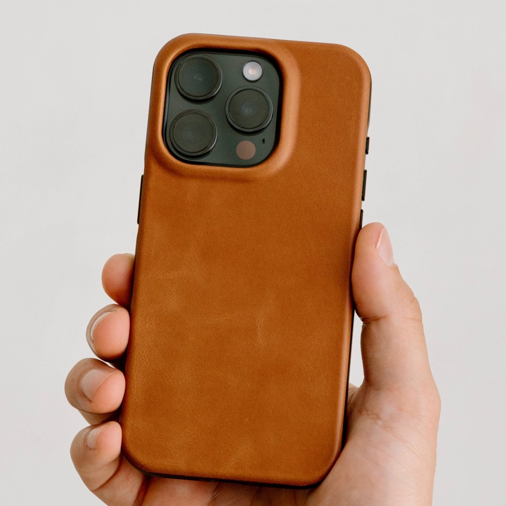 A hand holding a phone