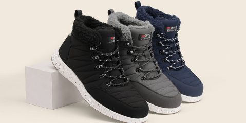 A group of shoes on a white surface