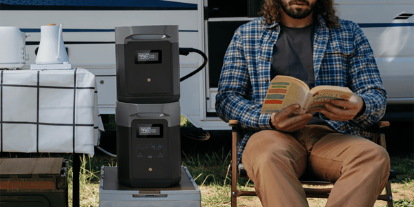 A man sitting in a chair reading a book