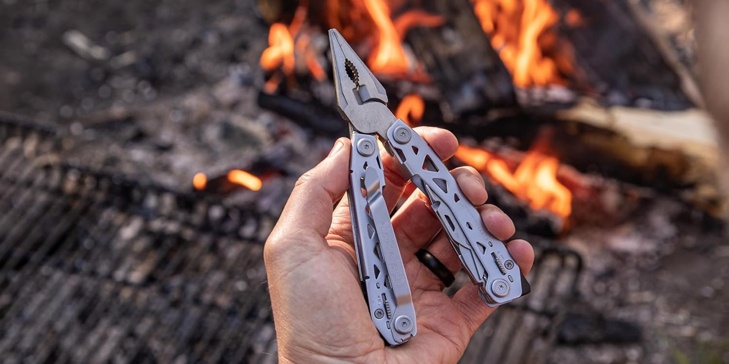 A hand holding a tool