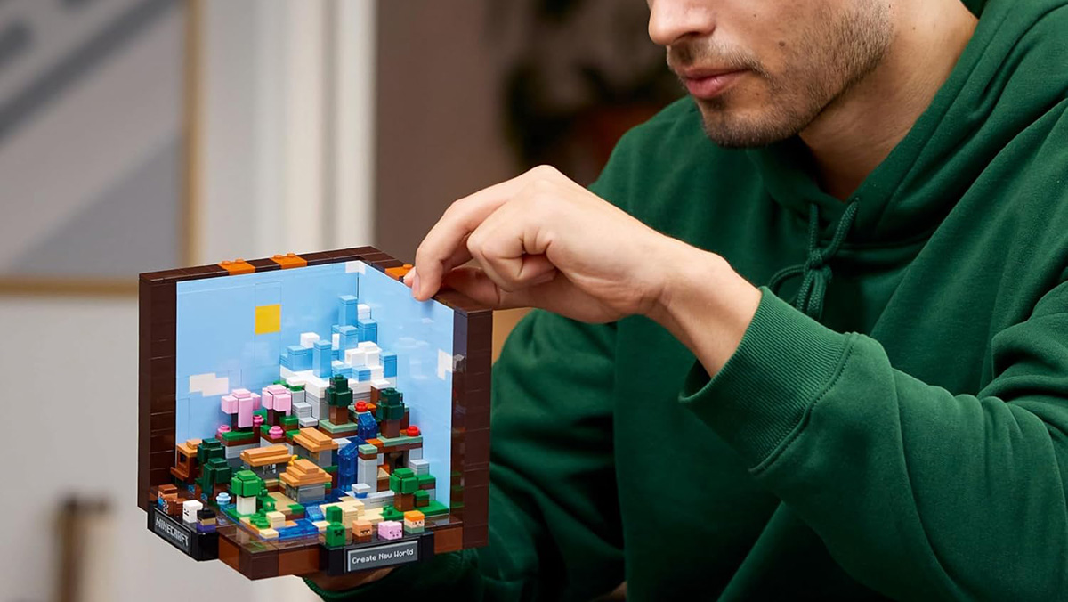 A man holding a lego block