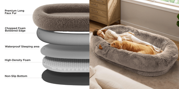 A woman sleeping in a dog bed