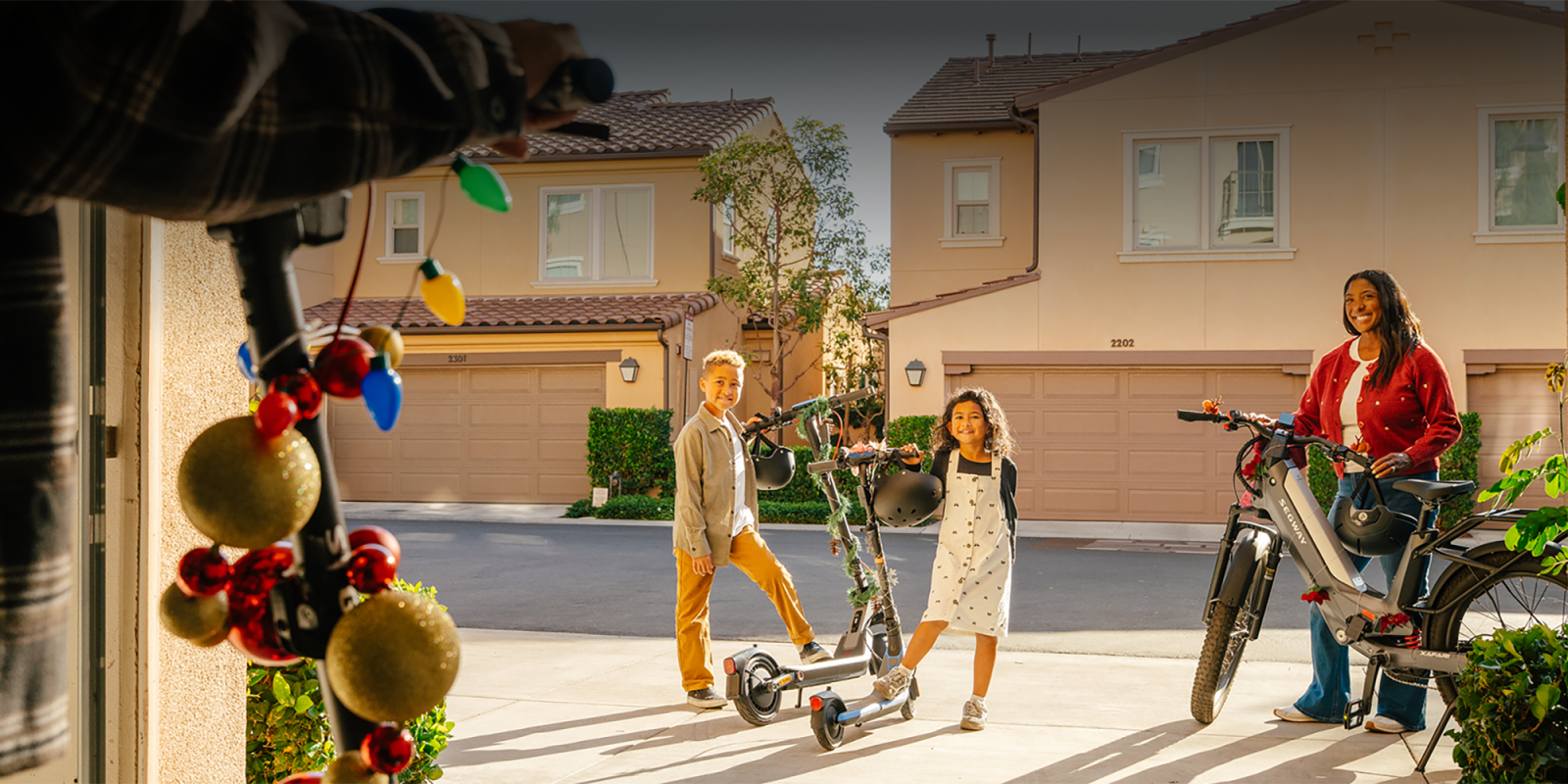 A boy and girl standing next to a scooter
