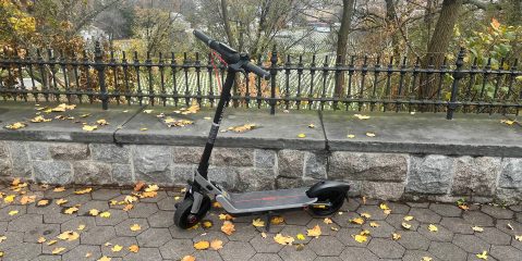 A scooter on a sidewalk