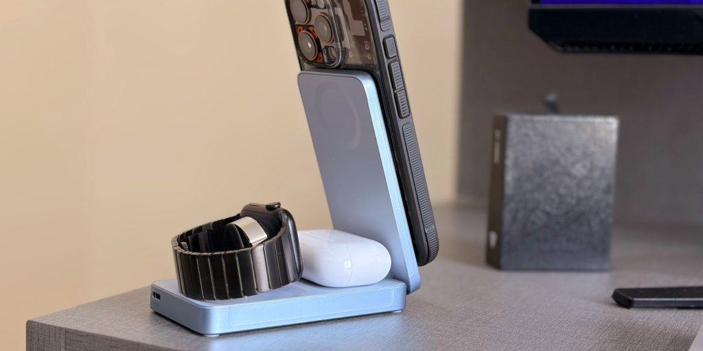 A smart watch and a watch on a stand