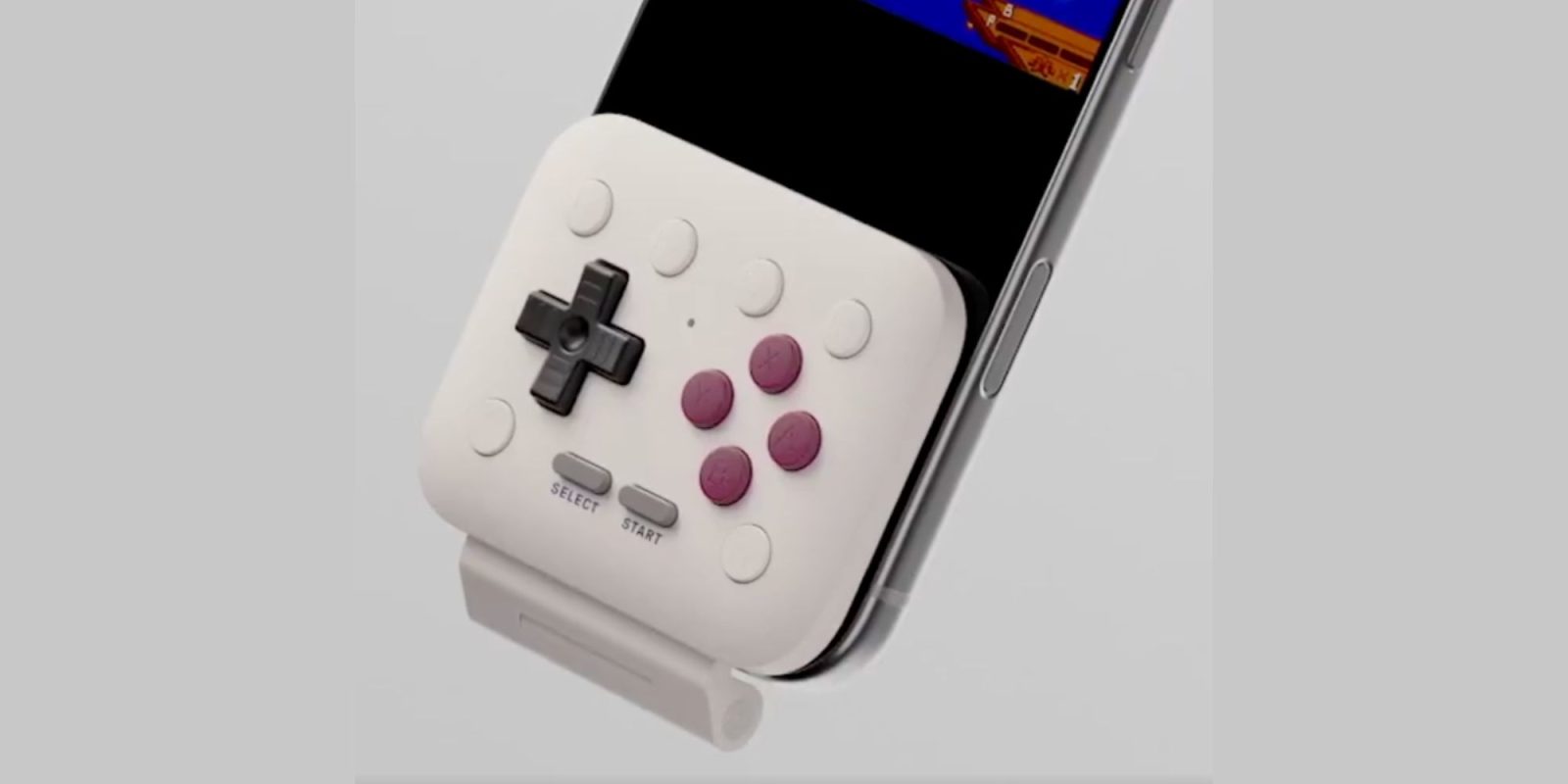 A white and purple game controller
