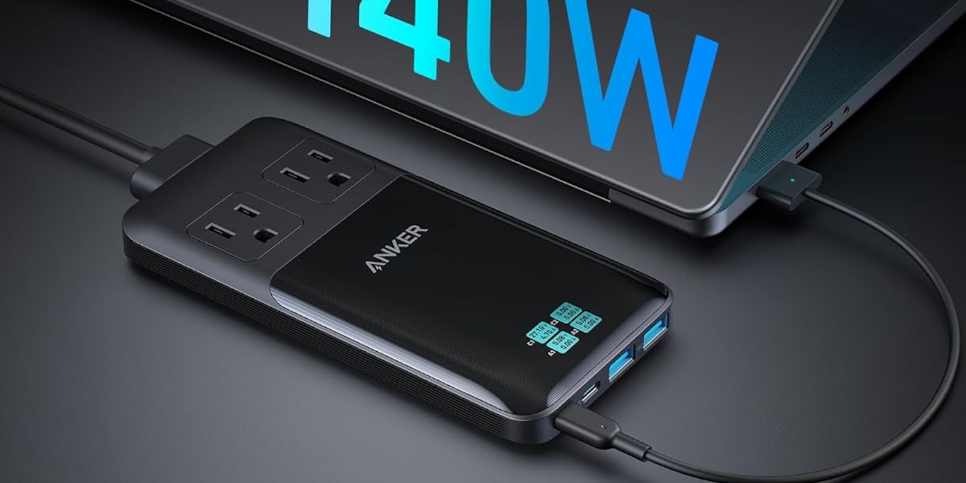 A black rectangular device with a cord plugged into it