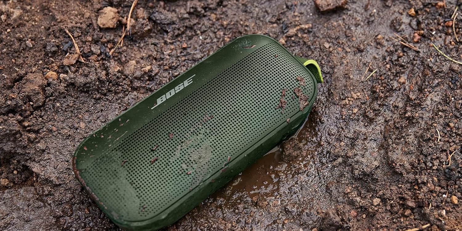 A green speaker in the mud