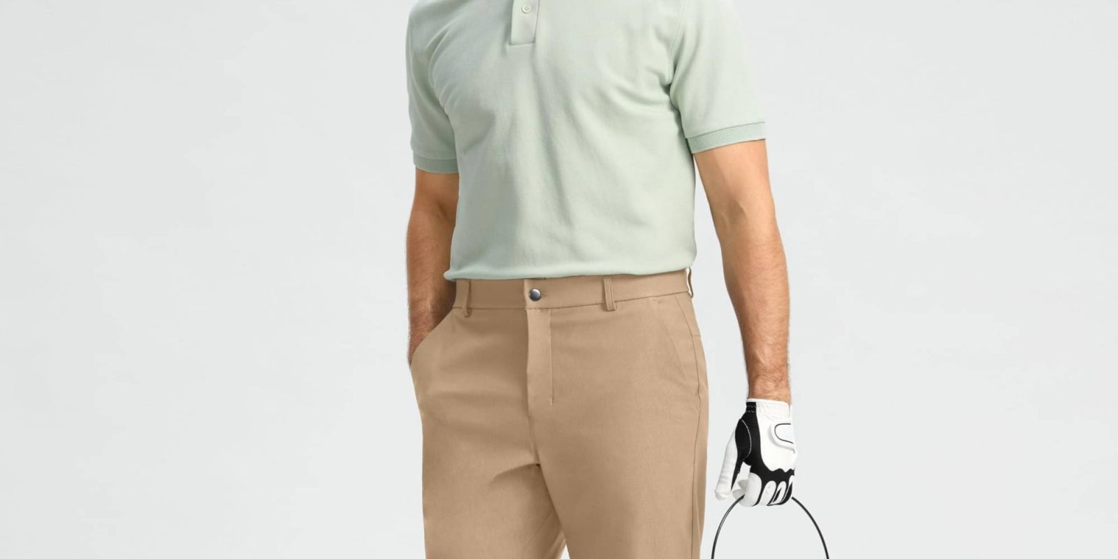 A man wearing a golf glove and holding a golf basket