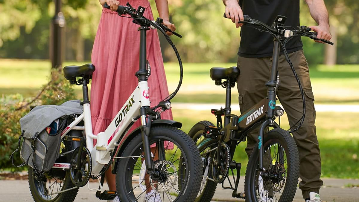 A man and woman standing next to bicycles