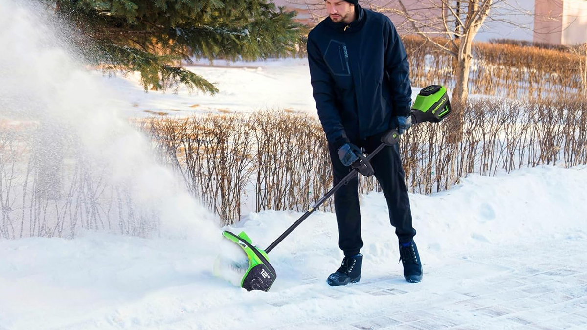 A man using a snow blower