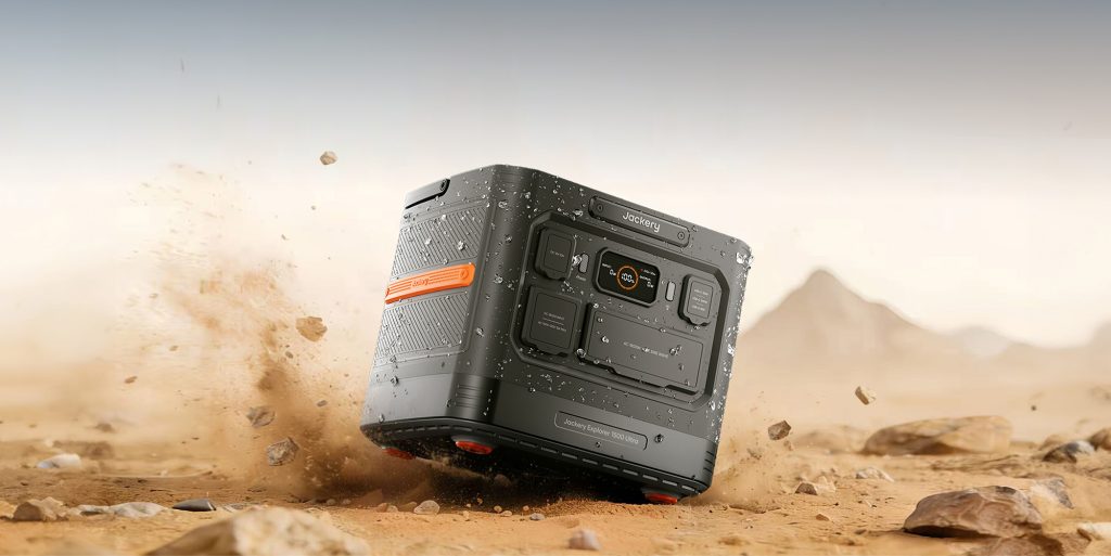 A square black device with orange and black accents