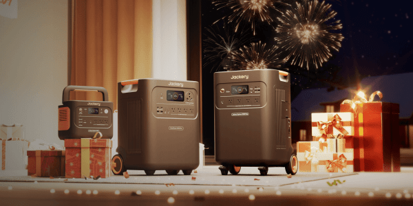 A group of luggage boxes with fireworks in the background