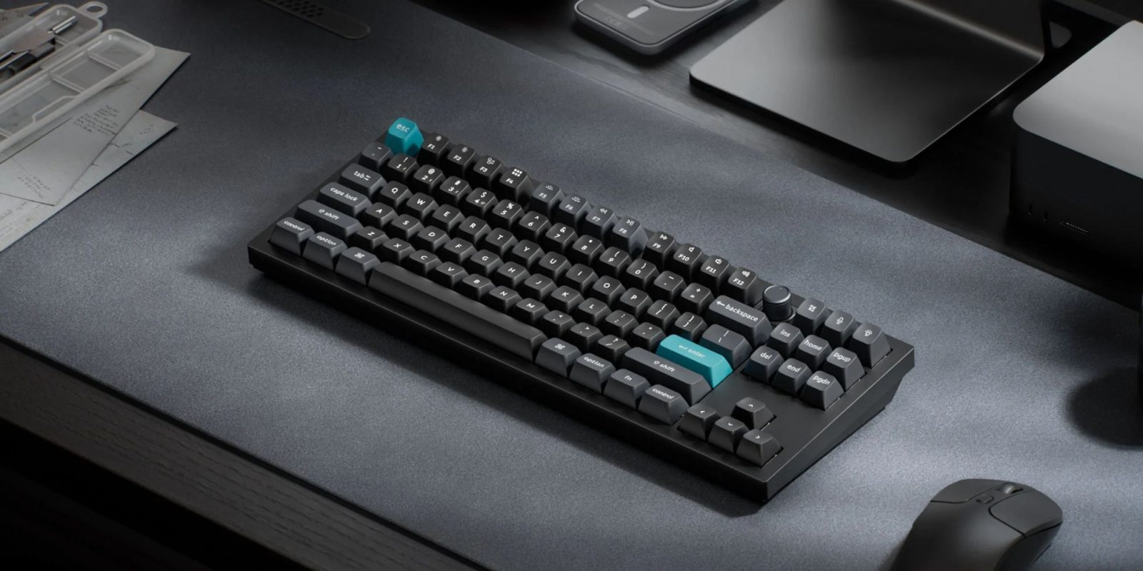 A black keyboard with a blue button