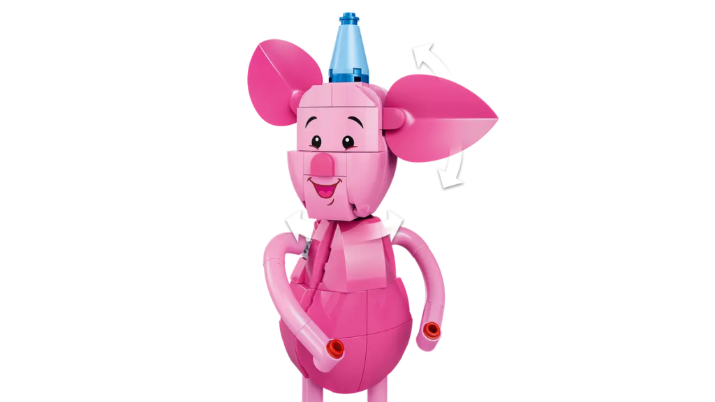 A pink toy animal with a blue cone