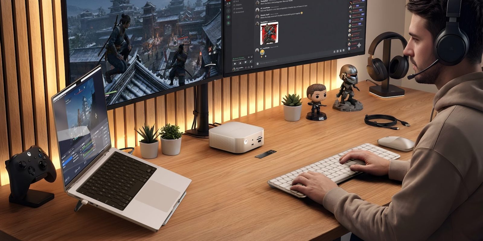 A person sitting at a desk with a computer and two monitors