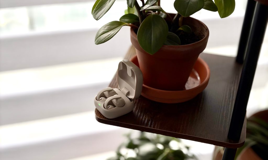 A white earbuds in a brown potted plant