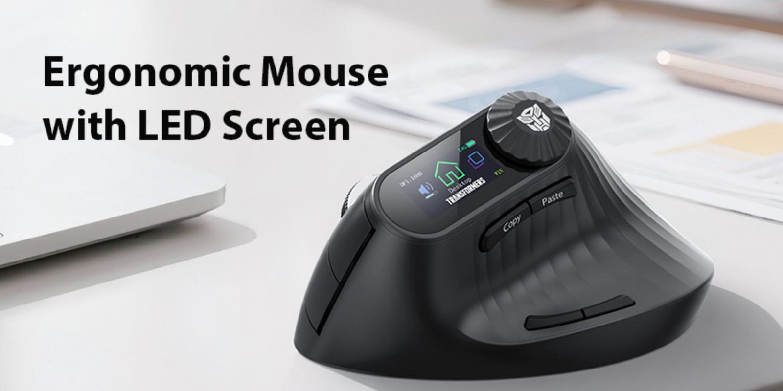 A black computer mouse on a white surface