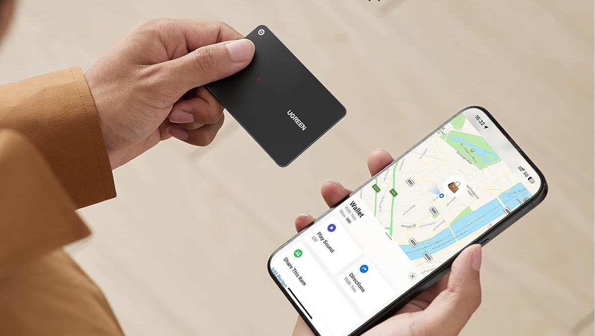 A person holding a phone and a card