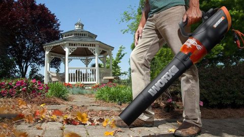 A man holding a vacuum