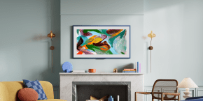 A fireplace with a painting on the wall