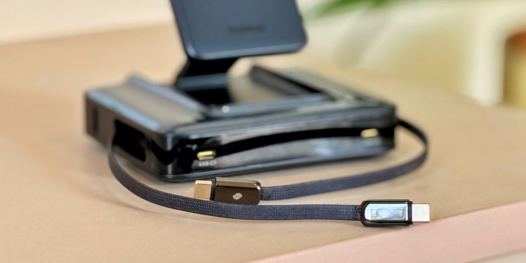 A black device with a cord