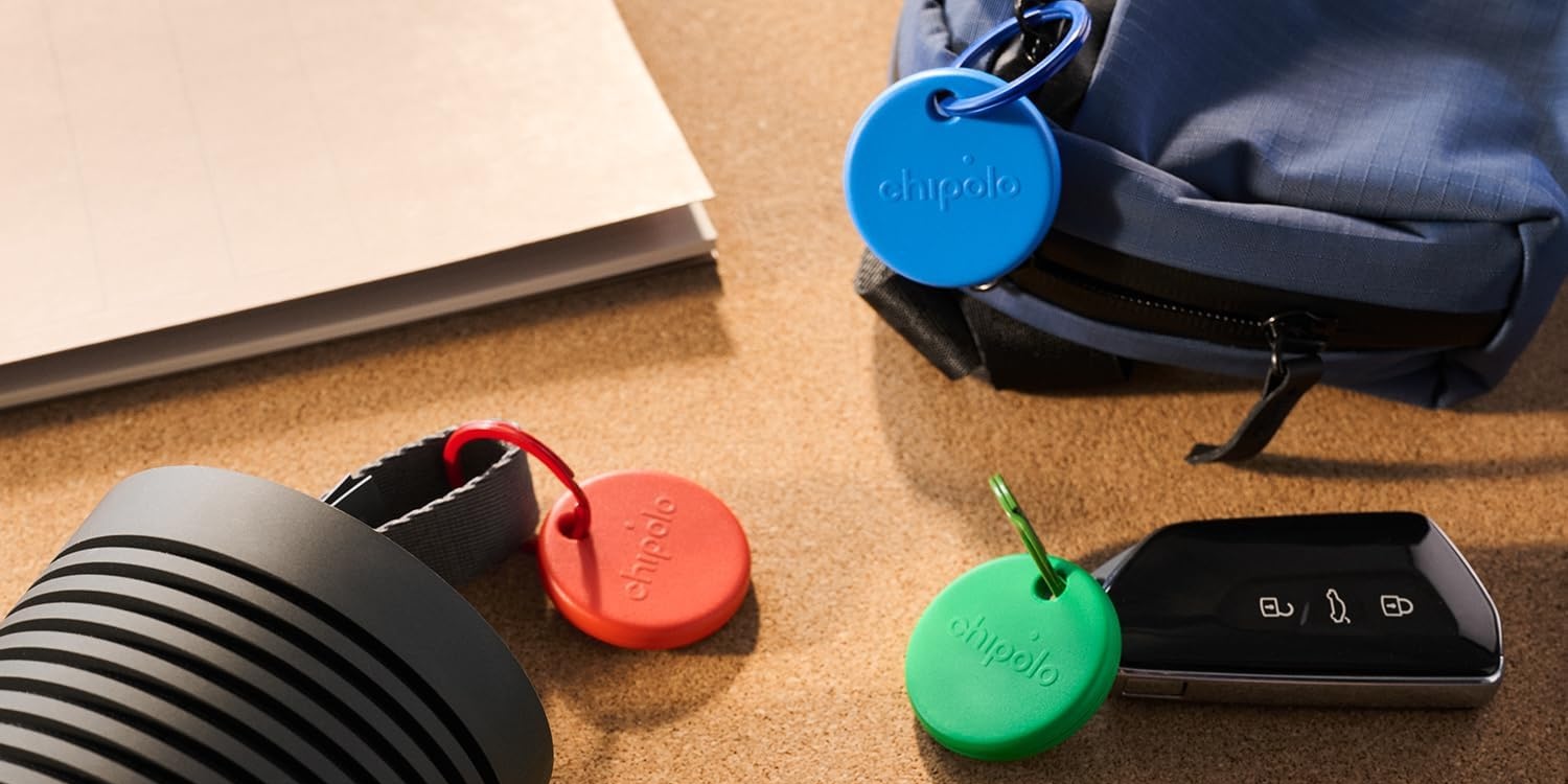 A group of round tags on a backpack