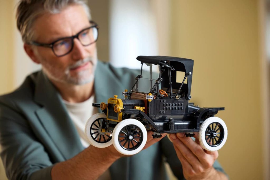 A man holding the LEGO Icons Model T