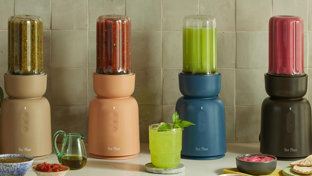 A blender with different colored liquid in it